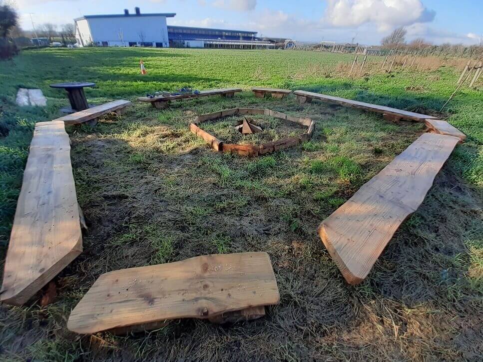 Campfire with logs around it forming a circle