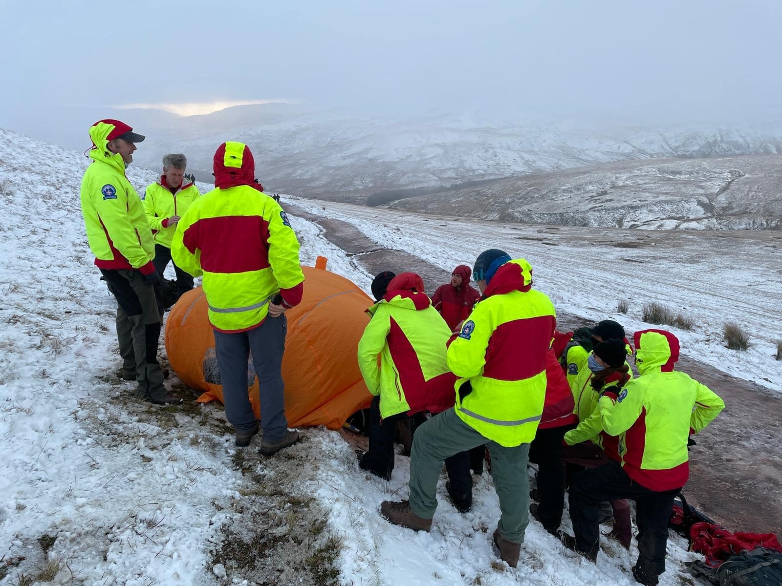 Image of mountain rescue in snow.